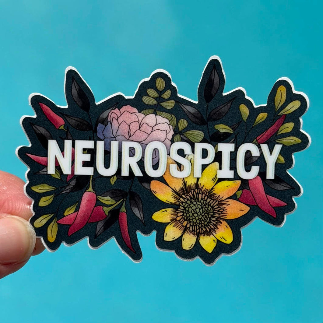 Sticker with floral design and 'NEUROSPICY' text held against a blue background