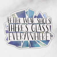 better wear shoes there’s glass everywhere sticker with glass depicted behind words