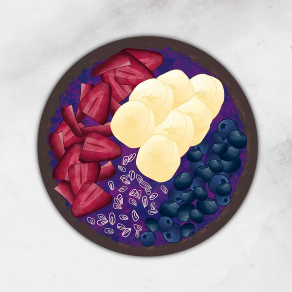3” x 3” sticker of acai bowl with strawberries, bananas, chia seeds, and blueberries in a coconut bowl